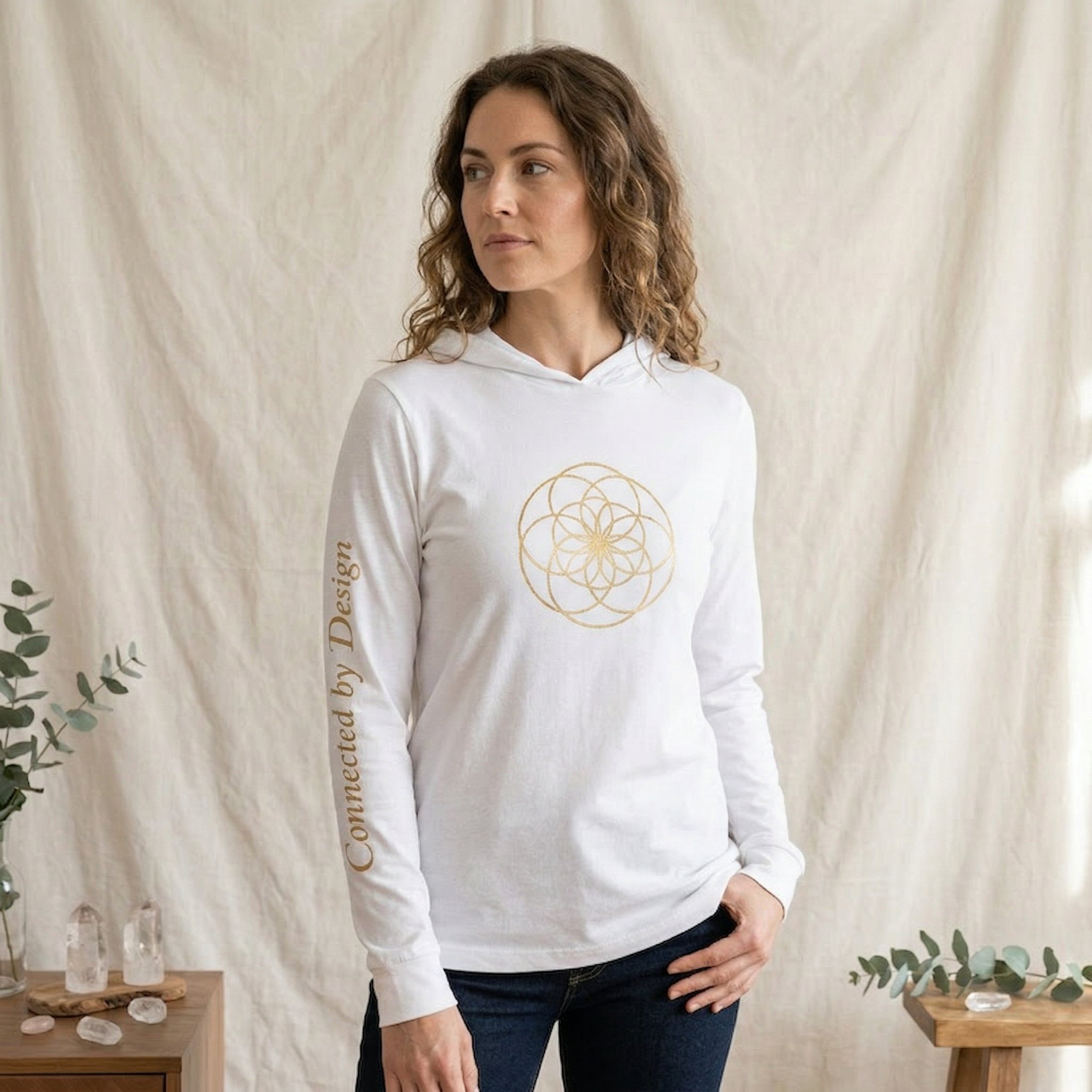 Women's Connected by Design white hoodie tee with gold seed of life and sleeve print